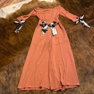 Size medium off the shoulder jumpsuit. Color is almost dark coral